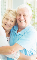 elderly couple hugging each other
