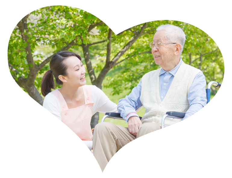 Elder in wheelchair talking to caregiver